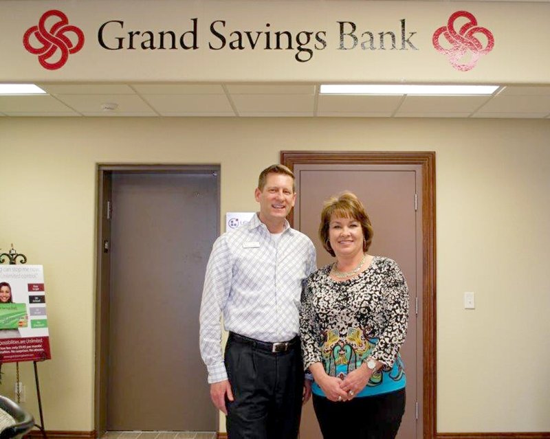 Submitted Photo Guy Cable, vice chairman of Grand Savings Bank, stands with Carla Martinez, a new loan officer.