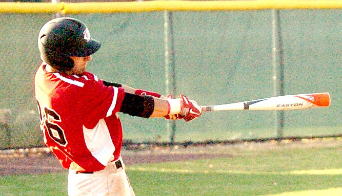 MARK HUMPHREY ENTERPRISE-LEADER Farmington's Cade Black cranks out an RBI single to end the game with a 10-0 Cardinal win over Berryville in five innings on April 11.