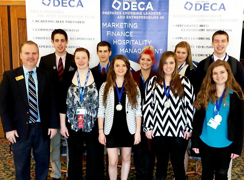 Submitted Photo DECA members pictured are Advisor Bob Johnson (left), Kyle Sands, Taylor West, Collin Boyer, Sarah Peronne, Hayley Arnold, Emily Ward, Trine Meisland, Jerica Brown and Cole Turner. Josh Lockhart is not pictured.