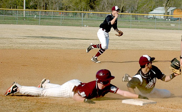 RANDY MOLL NWA MEDIA Lincoln shortstop Drew Harris moves up to assist the infield while fellow junior Emilio Marrufo tries to get a Gentry runner out at third. At the end of the school year Harris will transfer to Benton, where his father, Lincoln baseball and football coach Brad Harris, has taken a job as defensive coordinator. Lincoln recently beat Gentry, 13-2, with Drew Harris going 2-for-3 and scoring two runs. Marrufo was also 2-for-3 and added 2 RBIs with Dakota Riggin (2-3, 4 RBIs) and Tyler Cummings (3 IP) on the mound helping secure the victory.