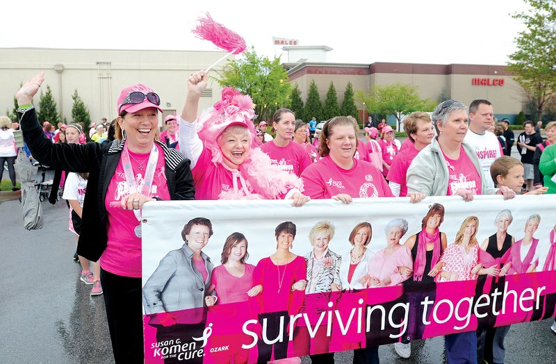 STAFF PHOTO SAMANTHA BAKER

Breast cancer survivors cheer as they march in the survivors’ parade at last year’s Race for the Cure. The annual fundraiser will be held Saturday in Rogers and includes 10K and 5K competitive runs, a 5K fun run, 1K family fun walk, a survivors’ breakfast and free giveaways from local vendors.