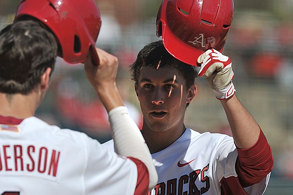 Arkansas batter Eric Fisher rounds the basses after a solo home run in the third inning of Wednesday afternoon's game against Northwestern State at Baum Stadium in Fayetteville.