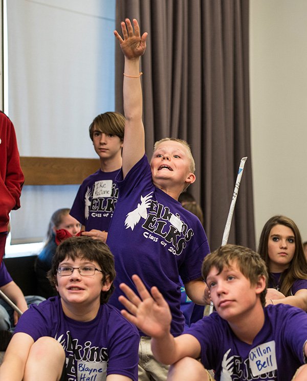 NWA Media/ANTHONY REYES 
Keagan Mount (center), a seventh-grader at Elkins Middle School, wants to answer a question Tuesday during a visit with the University of Arkansas engineering program at the Arkansas Union in Fayetteville. The students are part of UA Education Renewal Zone’s Adopt-A-Classroom project.