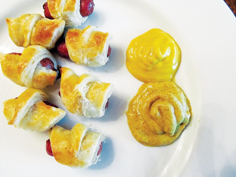 Pigs in Blankets are just one of the many dishes that have funny names. This great snack or appetizer is simply prepared with hot dogs or small sausages and biscuits, bread dough or puff pastry as the “blanket.”