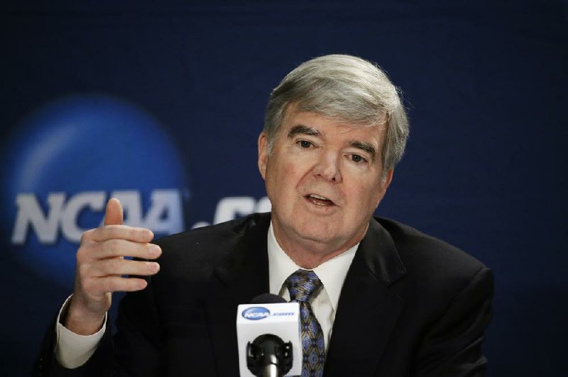 NCAA President Mark Emmert answers a question at a news conference Sunday, April 6, 2014, in Arlington, Texas. (AP Photo/David J. Phillip)