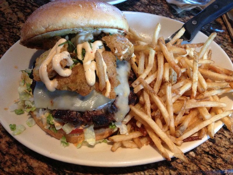 The Crispy Jalapeno Burger comes with crispy thin (pictured) or wedge-cut seasoned fries at BJ’s Restaurant Brewhouse in Little Rock. 
