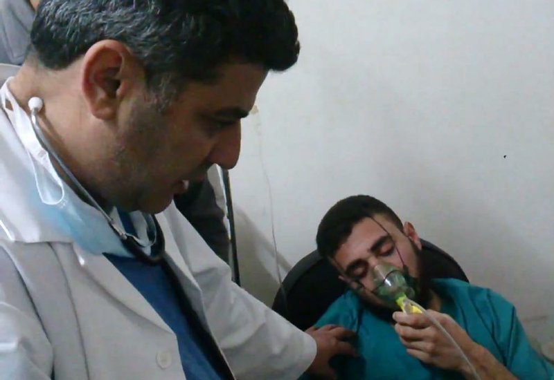 A Syrian man receives oxygen from a medic in a rebel-held village recently in this photo that activists say followed a chlorine-gas attack by Syrian government forces. 