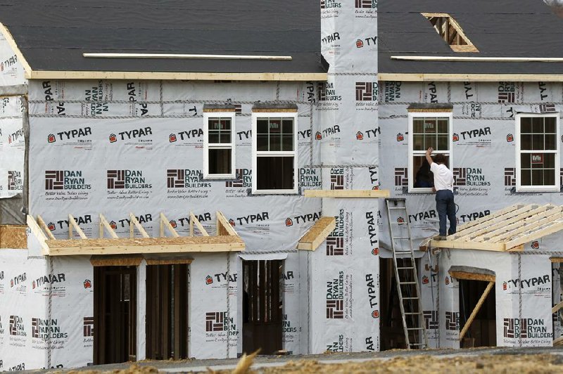 Sales of new homes — such as this one under construction in Zelienople, Pa. — fell 14.5 percent last month, the Commerce Department said Wednesday. 