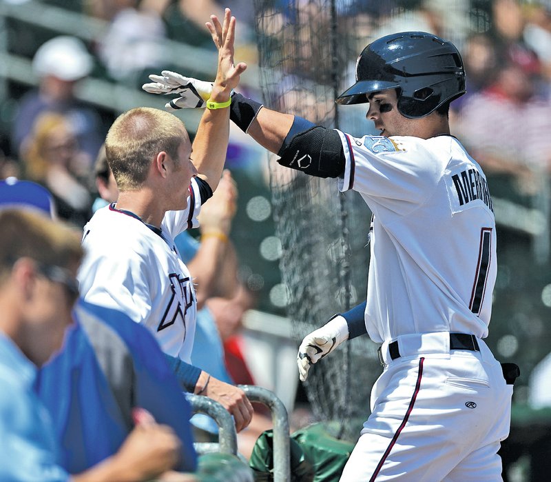  Staff Photo ANTHONY REYES Whit Merrifield of the Northwest Naturals celebrates a two-run home run against Springfield on Wednesday at Arvest Ballpark in Springdale.