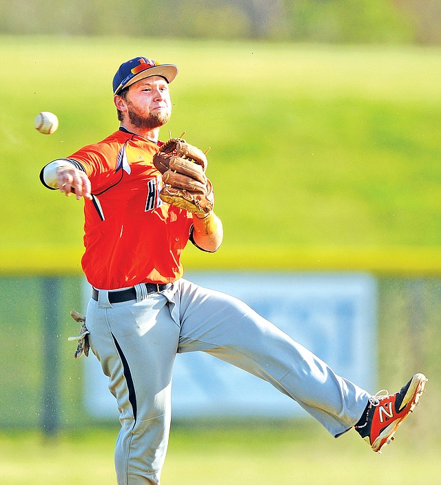 STAFF PHOTO SAMANTHA BAKER • @NWASAMANTHA Dalton McKaughan of Rogers Heritage makes the play to first base Wednesday against Springdale High at the Randall Tyson Recreational Complex in Springdale.