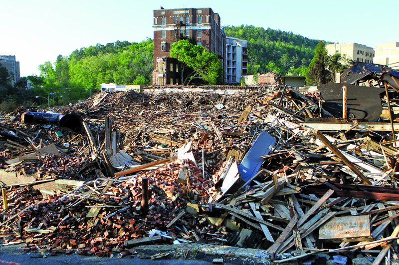 Heaps of rubble still cover the landscape at the site of the former Majestic Hotel, which burned Feb. 27. City officials say an assessment of the waste must be completed before they will know how to dispose of the debris.
