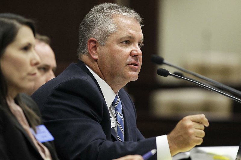 In this July 22, 2013, AP file photo, Arkansas Education Commissioner Tom Kimbrell testifies during a meeting of the Joint House and Senate Education Committee at the Arkansas state Capitol in Little Rock. (AP Photo/Danny Johnston)