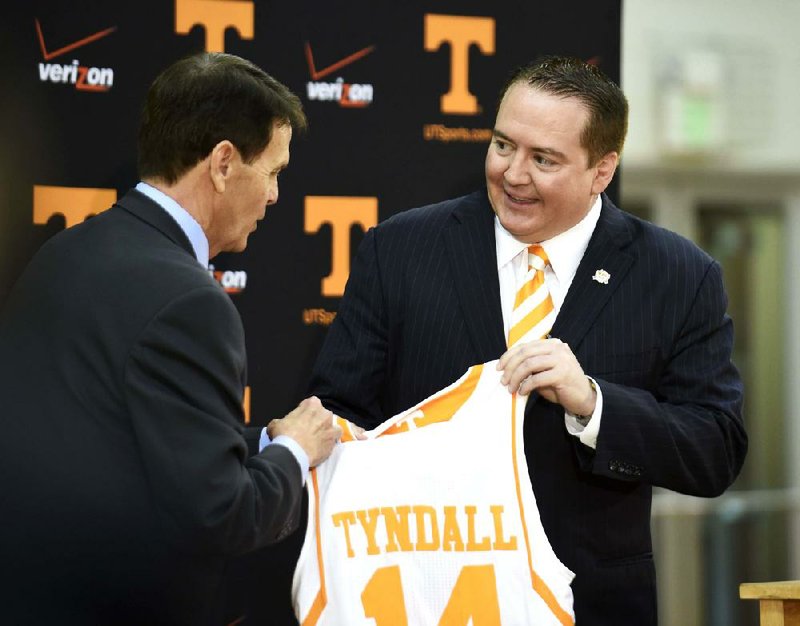 Donnie Tyndall, right, is introduced as Tennessee men's basketball coach by athletic director Dave Hart during a news conference Tuesday, April 22, 2014, in Knoxville, Tenn. The former Southern Mississippi coach succeeds Cuonzo Martin, who resigned last week to take the coaching job at California. (AP Photo/Knoxville News Sentinel, Amy Smotherman Burgess)