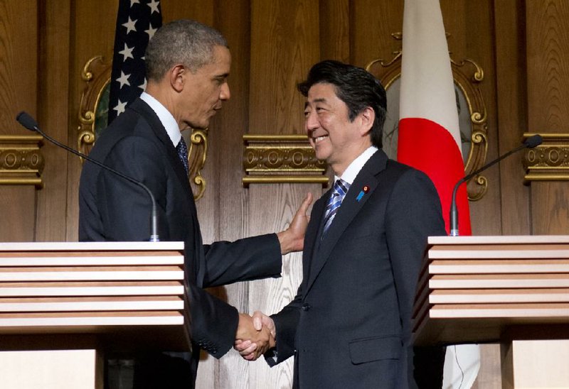 President Barack Obama and Japanese Prime Minister Shinzo Abe conclude a news conference Thursday in Tokyo. 