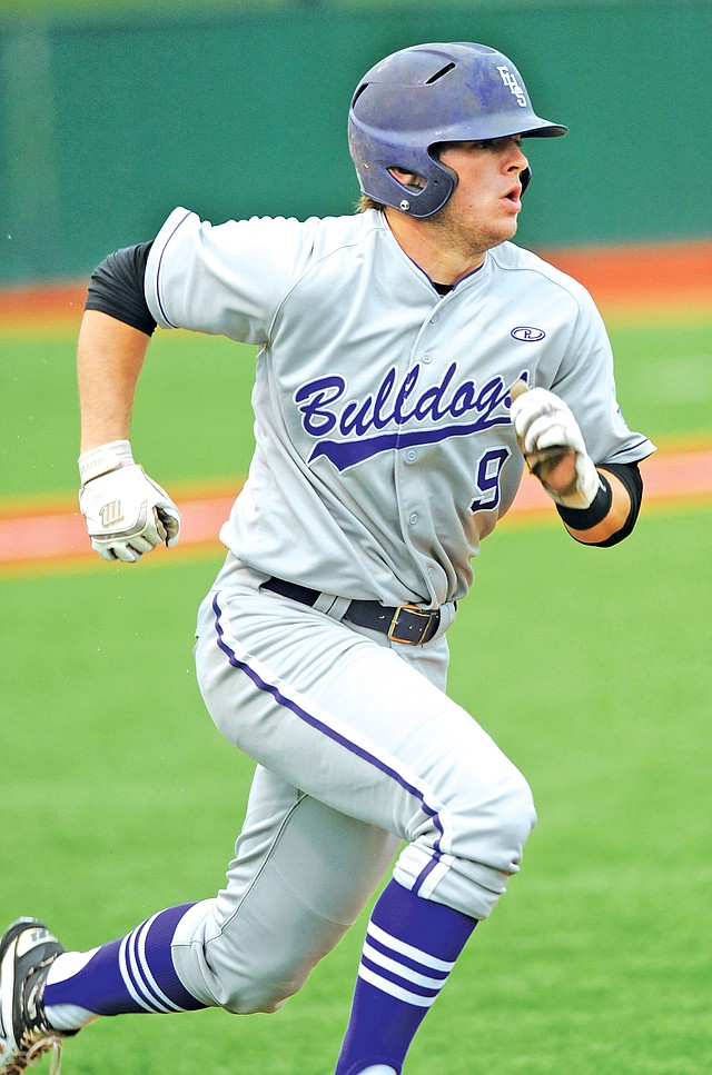 STAFF PHOTO ANDY SHUPE Drew Tyler of Fayetteville heads to first Thurday after hitting an RBI triple during the fourth inning of the Bulldogs&#8217; 1-0 win over Van Buren in Fayetteville.