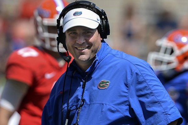 Florida coach Will Muschamp is all smiles after their spring NCAA college football scrimmage Saturday, April 12, 2014, in Gainesville, Fla. (AP Photo/Phil Sandlin)