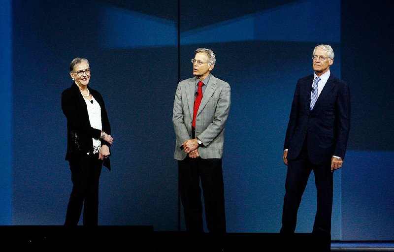 Alice Walton (from left), Jim Walton and Rob Walton, shown during the 2013 Wal-Mart shareholders meeting, and the John T. Walton Estate Trust, control about half of Wal-Mart’s 3.2 billion outstanding shares. 