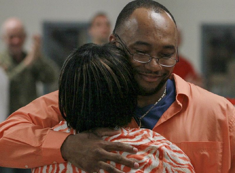 Ann Kennedy embraces her son, David Hood, during a Friday ceremony he spoke at recognizing inmates at the J.Aaron Hawkins Sr. Center in Wrightsville who have completed the Pathway to Freedom program. 
