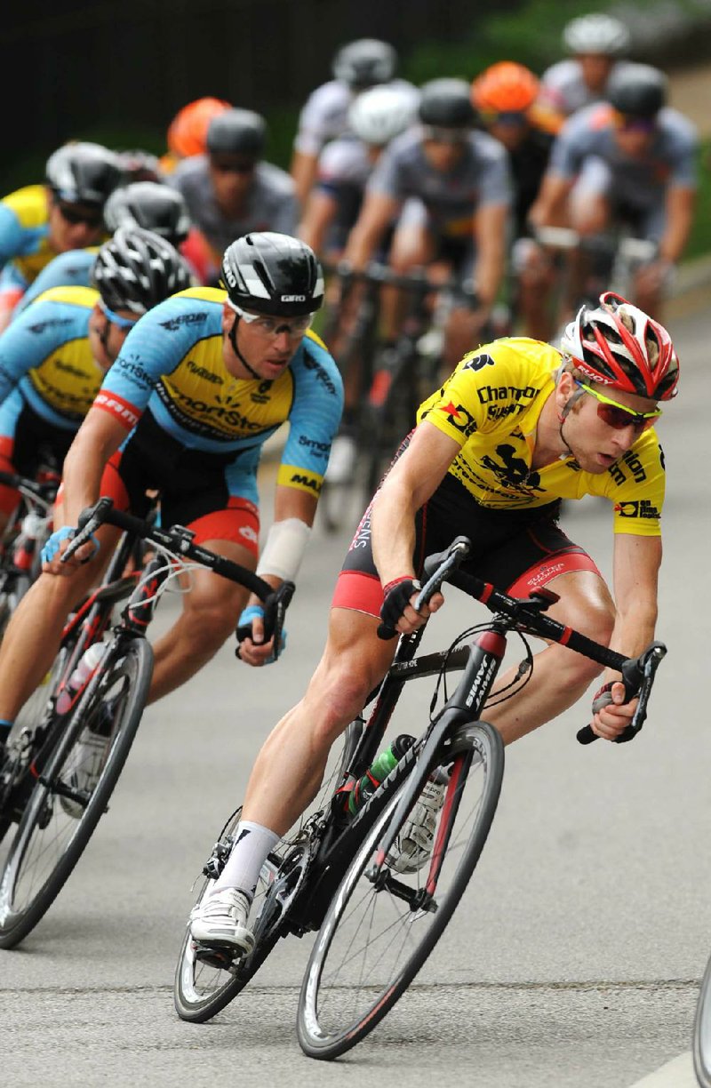 STAFF PHOTO ANDY SHUPE - Overall leader Ian Crane of Jamis-Hagens Berman participates in the criterium stage of the 37th annual Joe Martin Stage Race Sunday, April 27, 2014, in downtown Fayetteville.