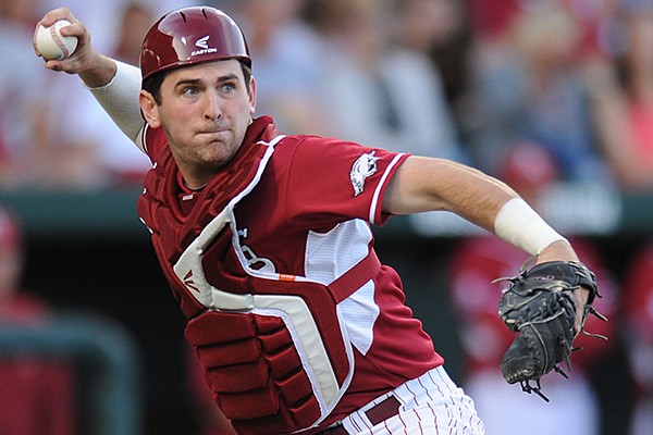 Arkansas catcher Jake Wise throws to first during the third inning against Auburn Friday, April 25, 2014, at Baum Stadium in Fayetteville.