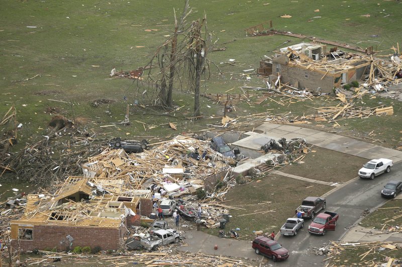 Houses are destroyed in Mayflower, Ark., Monday, April 28, 2014, after a tornado struck the town late Sunday. A tornado system ripped through several states in the central U.S. and left at least 17 dead in a violent start to this year's storm season, officials said.