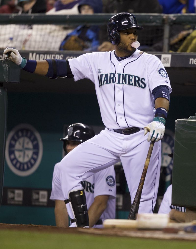 Seattle Mariners' Robinson Cano waits for an at-bat during a baseball game against the Seattle Mariners, Tuesday, April 22, 2014, in Seattle. (AP Photo/Stephen Brashear)