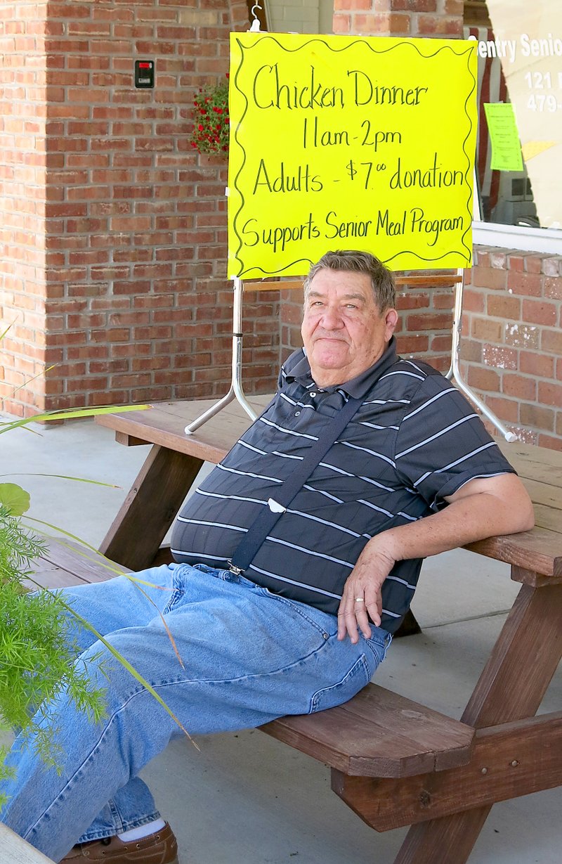 Photo by Randy Moll Denver Whitehead takes a break outside the Gentry Senior Activity Center on Friday after barbecuing chicken for the center&#8217;s meals program fundraiser.