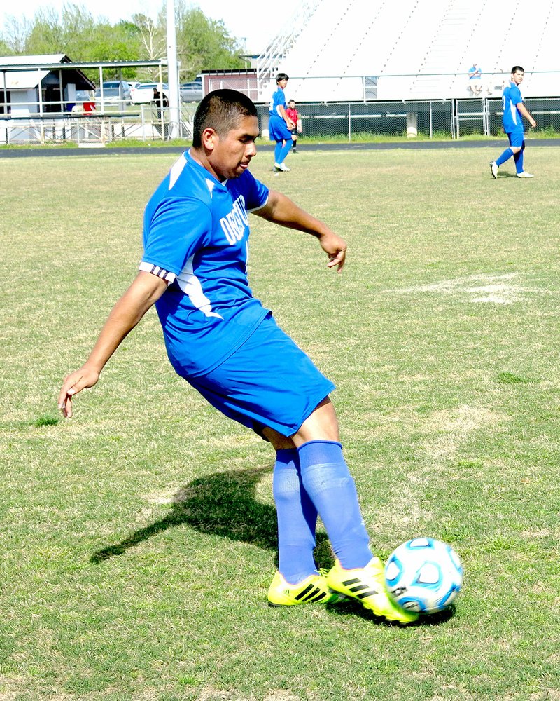 Photo by Mike Eckels Photo by Mike Eckels Decatur&#8217;s Alex Cordova gets his right foot in perfect position under the ball for a long kick towards the mid-field during the April 25 soccer match against the Panthers in Siloam Springs.