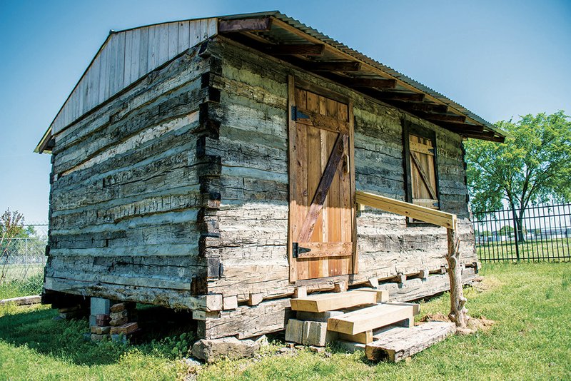 The new trapper cabin at Pioneer Village in Searcy was constructed from old logs reclaimed from part of a house that was being torn down.