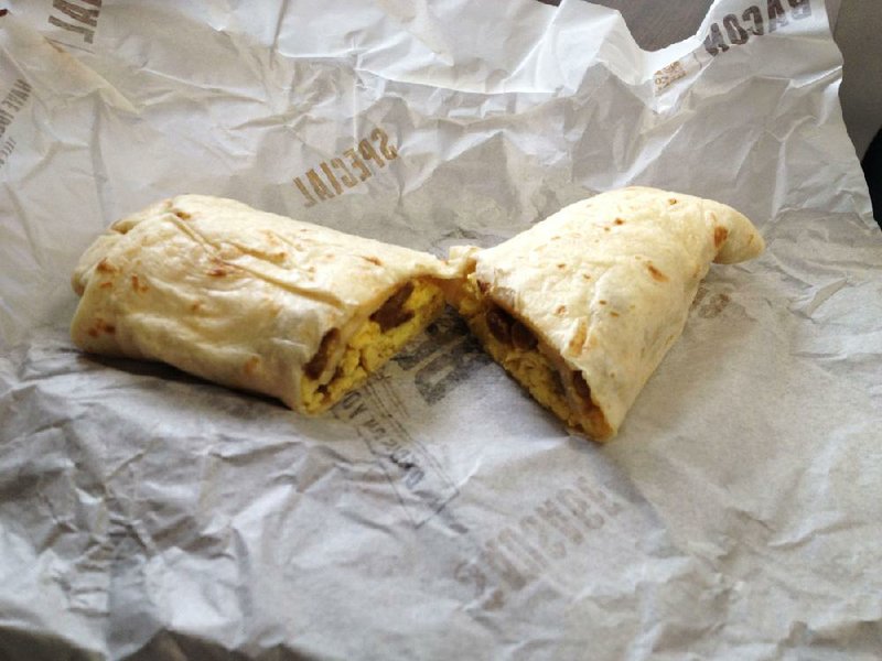 Taco Bell’s Breakfast Burrito wraps scrambled eggs, a little cheese and a choice of sausage or bacon. 
