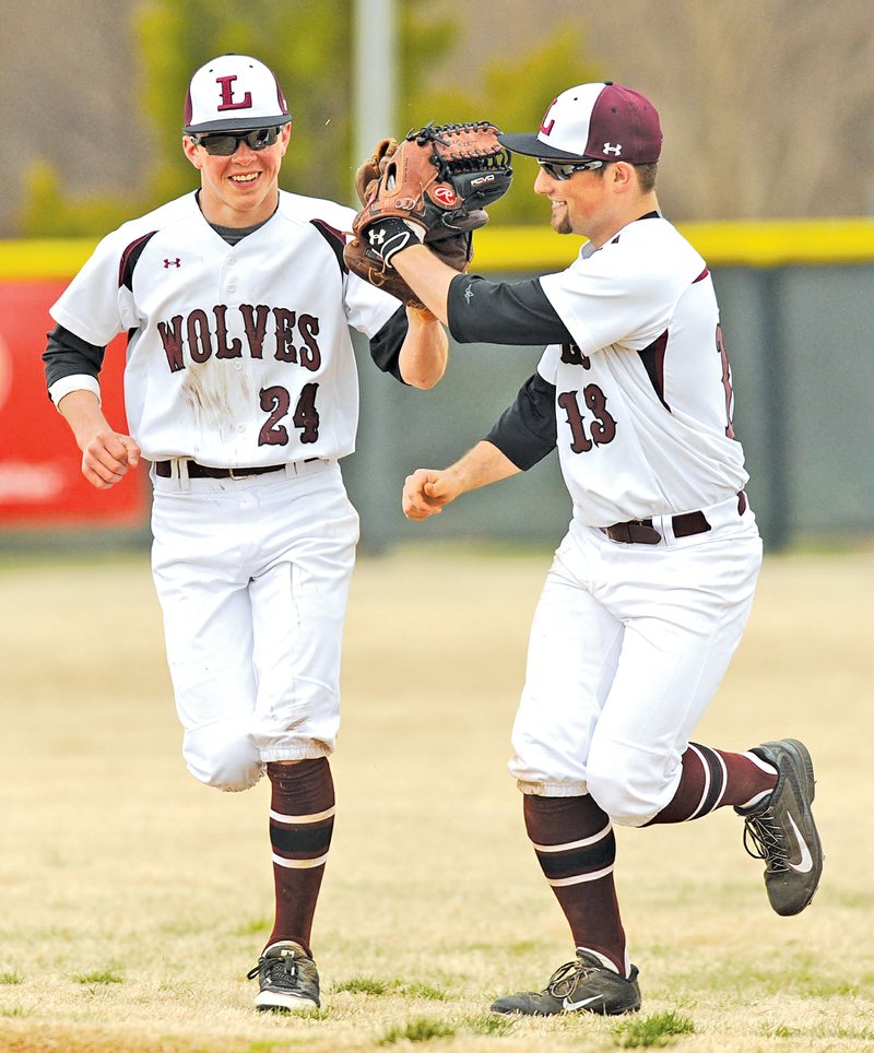  FILE PHOTO ANDY SHUPE Lane Maddox, left, Lincoln&#8217;s right fielder, is congratulated by Dalton Simmons after making a catch to end the fifth inning against Stillwater, Okla., on March 21 at Bob Lyall Field in Springdale.