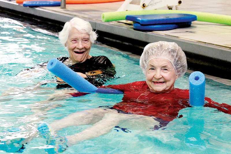 Jane Hogan, right, 89, and Lillian Mciver, 96, participate in water aerobics with Searcy Splash.