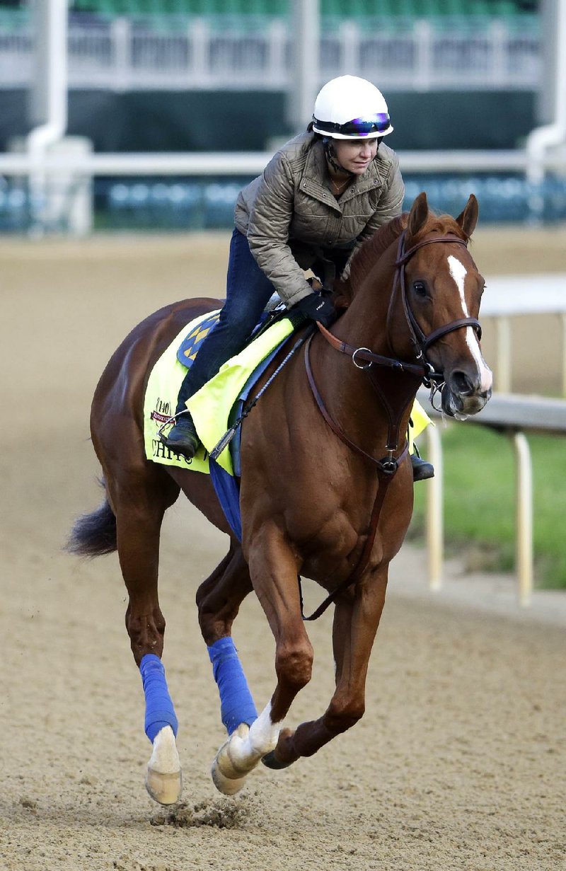 Exercise rider Dana Barnes takes Kentucky Derby entrant Chitu for a morning workout at Churchill Downs Thursday, May 1, 2014, in Louisville, Ky. (AP Photo/Morry Gash)