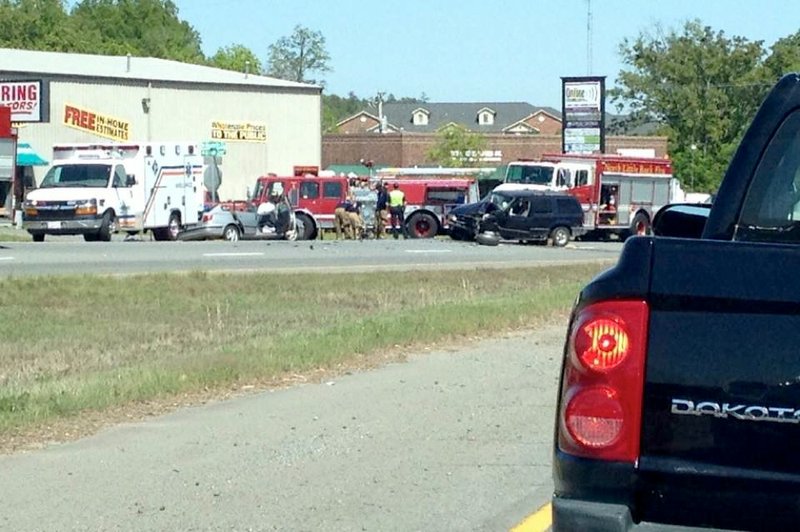 Rescuers respond Saturday, May 3, 2014, to a wreck on Maumelle Boulevard in North Little Rock.