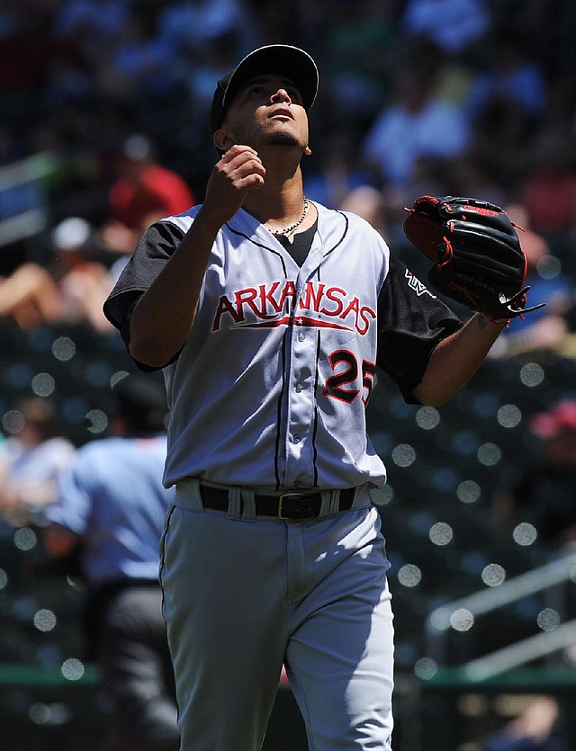 STAFF PHOTO ANDY SHUPE - Arkansas Travelers starter Yeiper Castillo reacts to the final out during the first inning against Northwest Arkansas Sunday, May 4, 2014, at Arvest Ballpark in Springdale.