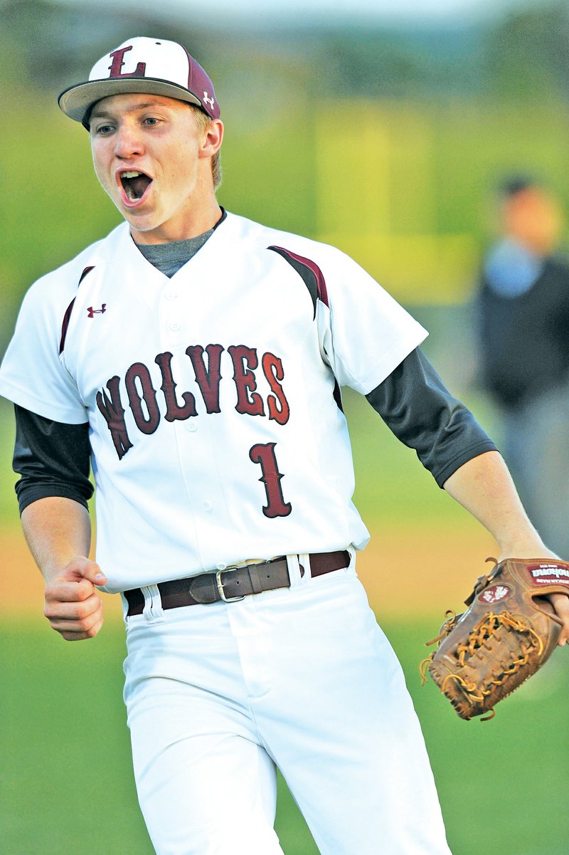 STAFF PHOTO ANDY SHUPE Drew Harris, Lincoln starter, celebrates the Wolves&#8217; 7-0 win Monday over Prairie Grove in the finals of the 4A-1 District tournament in Prairie Grove.