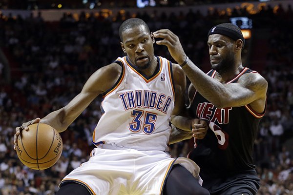 In this Jan. 29, 2014 file photo, Miami Heat small forward LeBron James (6) puts pressure on Oklahoma City Thunder small forward Kevin Durant (35) during the fourth period of an NBA basketball game in Miami. James says Durant would be a deserving winner of the NBA MVP award. It's expected that Durant will be announced as this season's MVP later this week. (AP Photo, Alan Diaz, File)