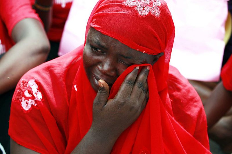 A woman cries Tuesday during a demonstration outside defense headquarters in Abuja, Nigeria, calling for the government to rescue teenage schoolgirls abducted by Boko Haram. 