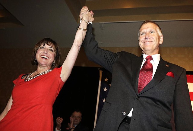 Thom Tillis and his wife, Susan, greet supporters at an election-night rally in Charlotte, N.C., after winning the Republican nomination for the U.S. Senate on Tuesday. 