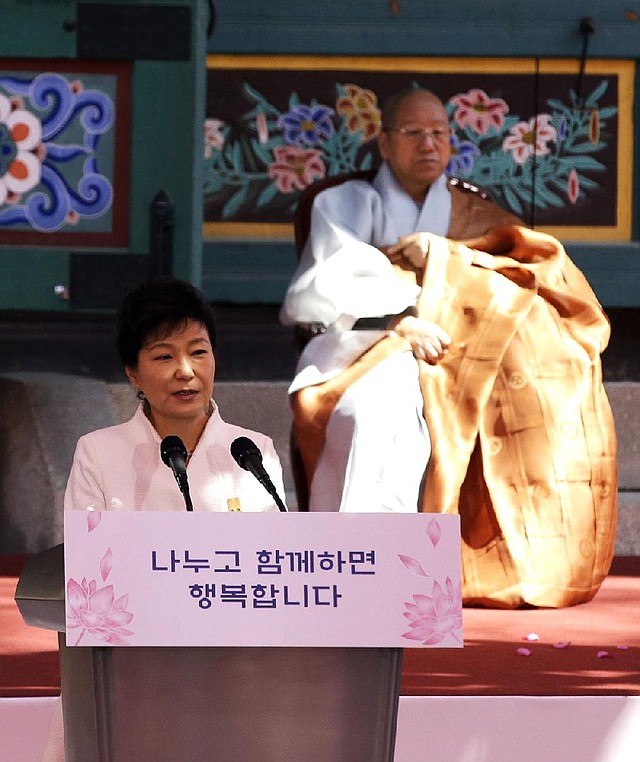 South Korean President Park Geun-hye delivers a speech about the sunken ferry Sewol during a celebration of Buddha’s birthday Tuesday at the Jogye temple in Seoul.