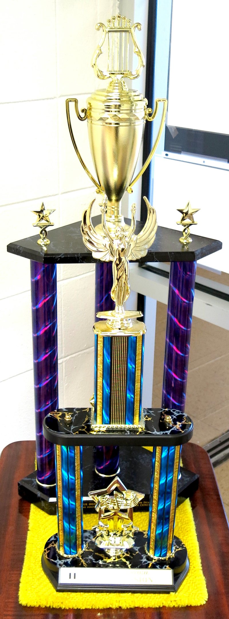 Photo by Mike Eckels Two trophies are on display in the office of Decatur High School earned by the high school band during a resent trip to southeastern Missouri April 12 and 26. The first trophy (front) is for a II rating in the Nevada band concert division. The second is an award given to the symphonic band by the organizers of the &#8220;Legends In Concert Show&#8221; in Branson April 26.