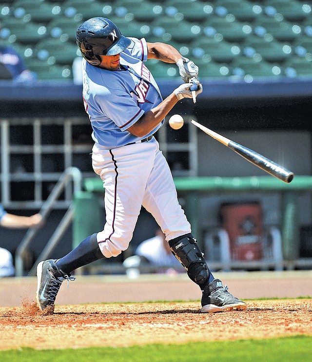  STAFF PHOTO SAMANTHA BAKER &#8226; @NWASAMANTHA Jorge Bonifacio of the Northwest Arkansas Naturals snaps his bat in half Tuesday at Arvest Ballpark in Springdale during the game against the visiting Arkansas Travelers.