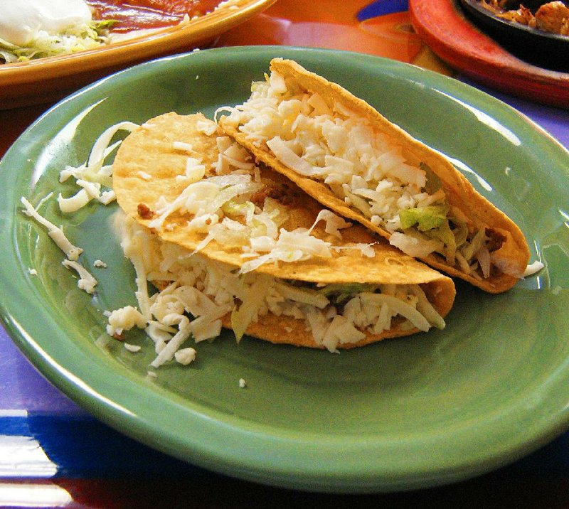 The crispy beef tacos at Cancun Mexican Restaurant in Jacksonville are filled with seasoned ground beef, lettuce and cheese.