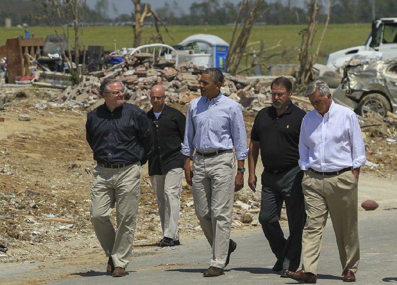 U.S. Sen. Mark Pryor (from left, front row) views the damage Wednesday in Vilonia with President Barack Obama, Vilonia Mayor James Firestone and Gov. Mike Beebe. 