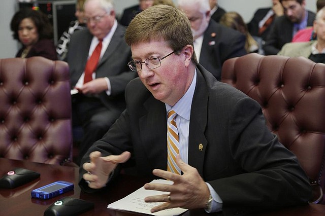 Sen. Johnny Key, R-Mountain Home, presents a bill dealing with school choice during a meeting of the Senate Committee on Education at the Arkansas state Capitol in Little Rock, Ark., Wednesday, March 27, 2013. The measure passed. (AP Photo/Danny Johnston)