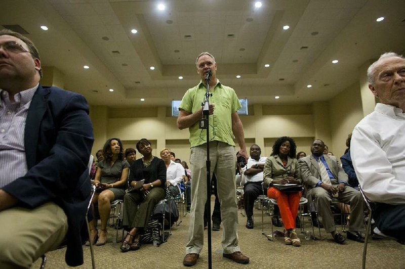 Arkansas Democrat-Gazette/MELISSA SUE GERRITS - 05/08/2014 -  Dan Oberste asks a question to Eric Higgins during a public forum May 8, 2014 at the Center at University Park. Higgins in running for LRPD chief. 