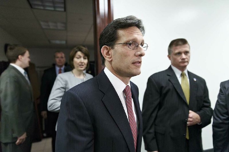 House Majority Leader Eric Cantor, R-Va., followed by Rep. Cathy McMorris Rodgers, R-Wash., leaves a closed-door Republican strategy meeting to join House Speaker John Boehner for a news conference at the Capitol in Washington, Wednesday, May 7, 2014. Boehner has created a special select committee investigating the attack on the U.S. diplomatic outpost in Benghazi, Libya, that killed the ambassador and three other Americans. Benghazi resonates with Republicans and remains a rallying cry with conservatives whose votes are crucial to the GOP in November's historically low-turnout midterm elections.  (AP Photo/J. Scott Applewhite)