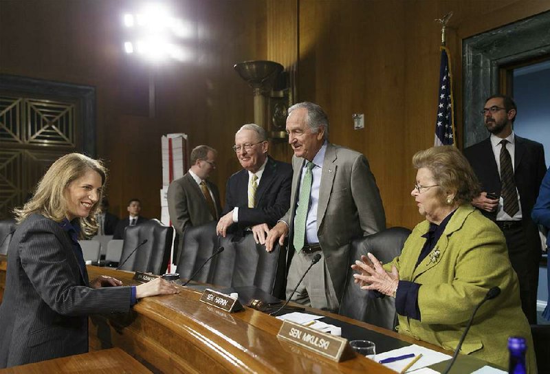 Sylvia Mathews Burwell, left, President Barack Obama’s nominee to become secretary of Health and Human Services, is greeted by members of the Senate Health, Education, Labor and Pensions Committee, from right, Sen. Barbara A. Mikulski, D-Md., Sen. Tom Harkin, D-Iowa, chairmanand, and Sen. Lamar Alexander, R-Tenn., the ranking member, as she arrives for her confirmation hearing, on Capitol Hill in Washington, Thursday, May 8, 2014. Burwell has found favor with both Republicans and Democrats in her current role as the head of the Office of Management and Budget and would replace Kathleen Sebelius who resigned last month after presiding over the Affordable Care Act and its problematic rollout. (AP Photo/J. Scott Applewhite)