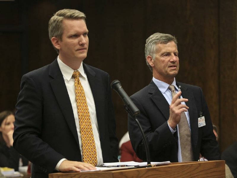 Arkansas Democrat-Gazette/STATON BREIDENTHAL --5/8/14-- Chris Baumann (left), general consel for Responsive Education Solutions, and Little Rock School District attorney Chris Heller answer questions about a new proposed location for the Quest charter school's Thursday afternoon at a state Board of Education meeting. 