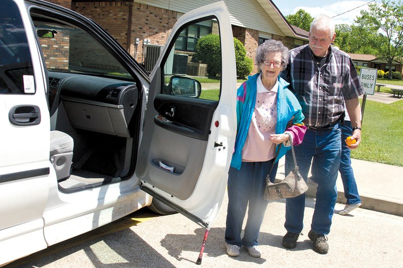 Dennis Riley, right, helps Lila Dugger into the Independence County Senior Citizens Program van after a lunch at the senior center. The van is one service offered to senior citizens to help them get to doctor’s appointments, the grocery store and other activities.